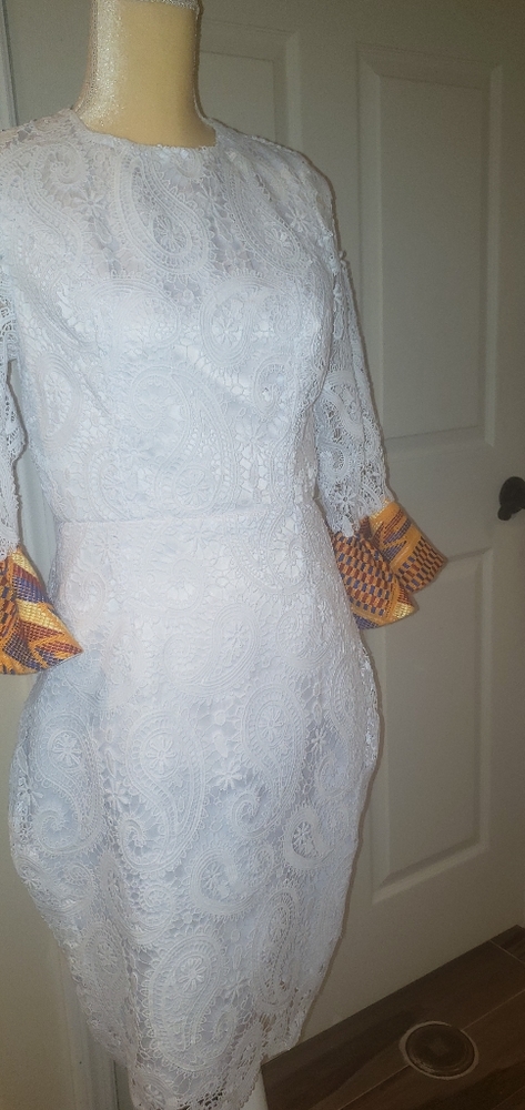Beautiful white dress design with a Weaved kente